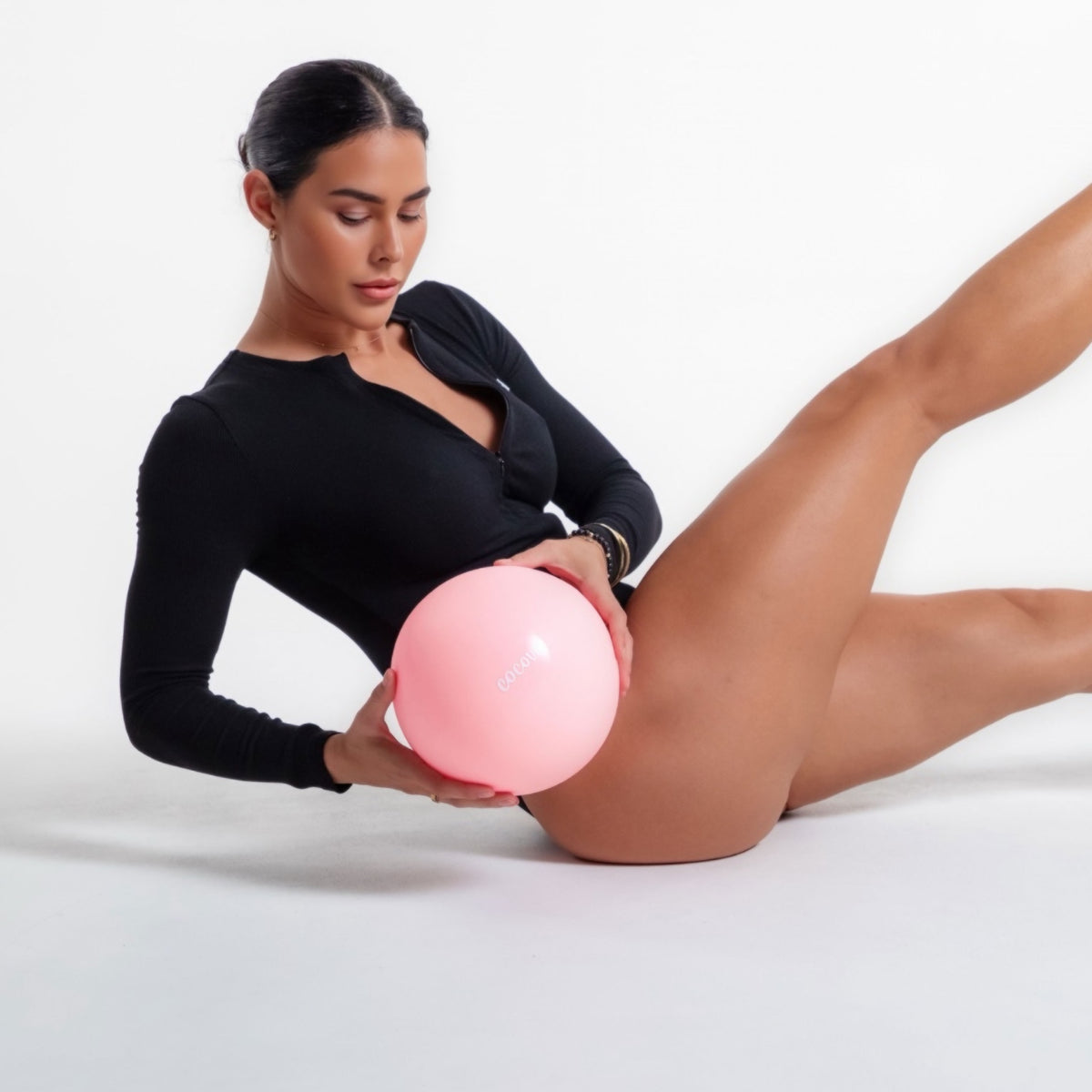 Model using the Cocove Muse Pilates Mini Ball